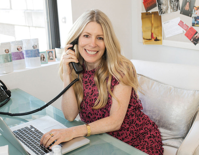 Photo: Sarah Kugelman at her design talking on the phone