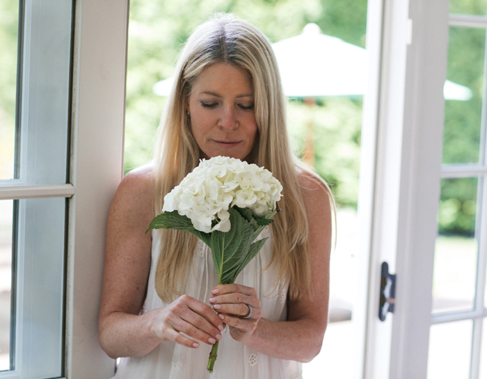 Photo: Sarah Kugelman with floral arrangement